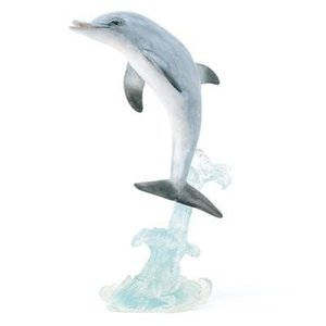 Dolphin dancing on a wave